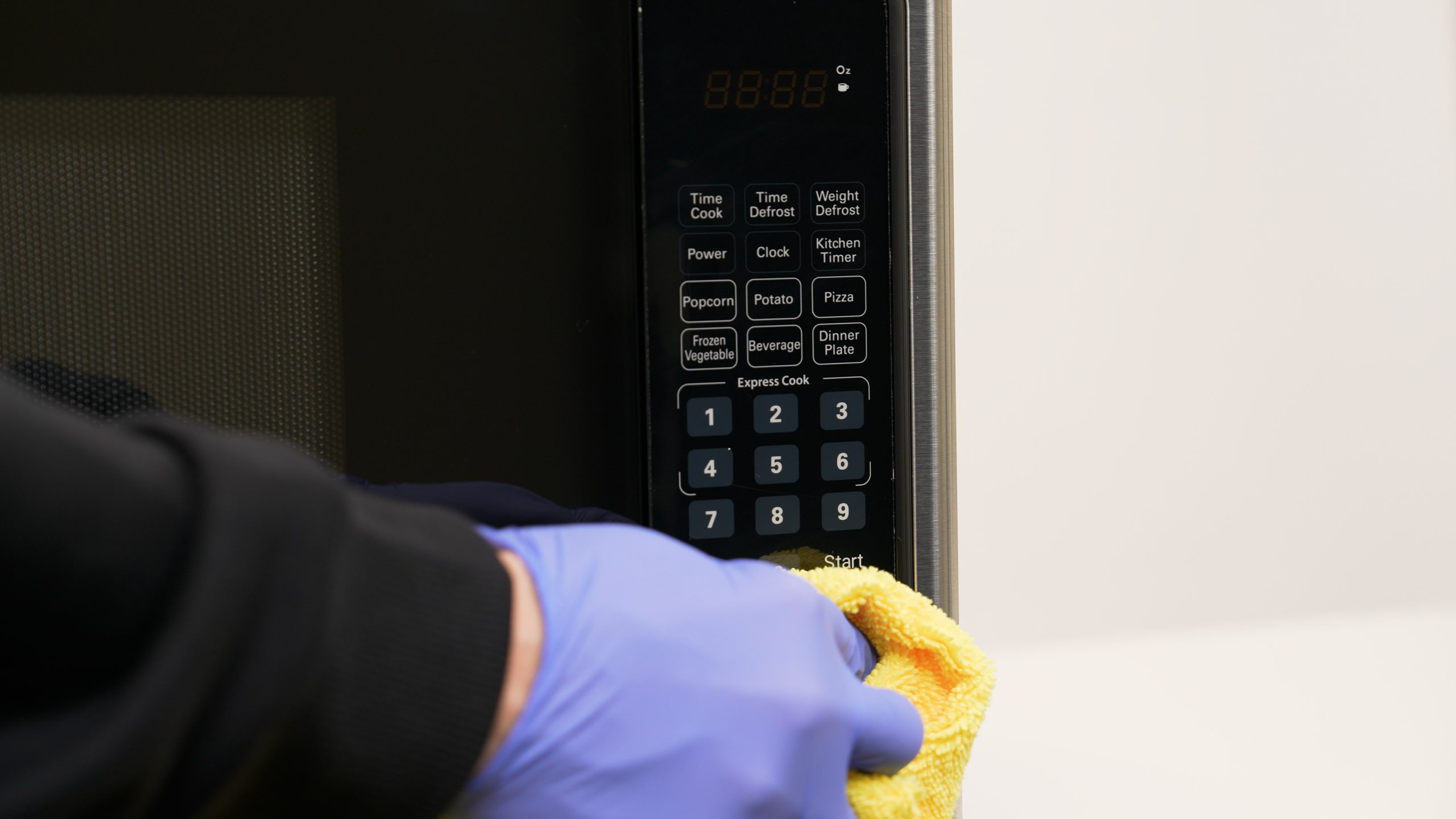 professional move-out cleaning - cleaning microwave oven